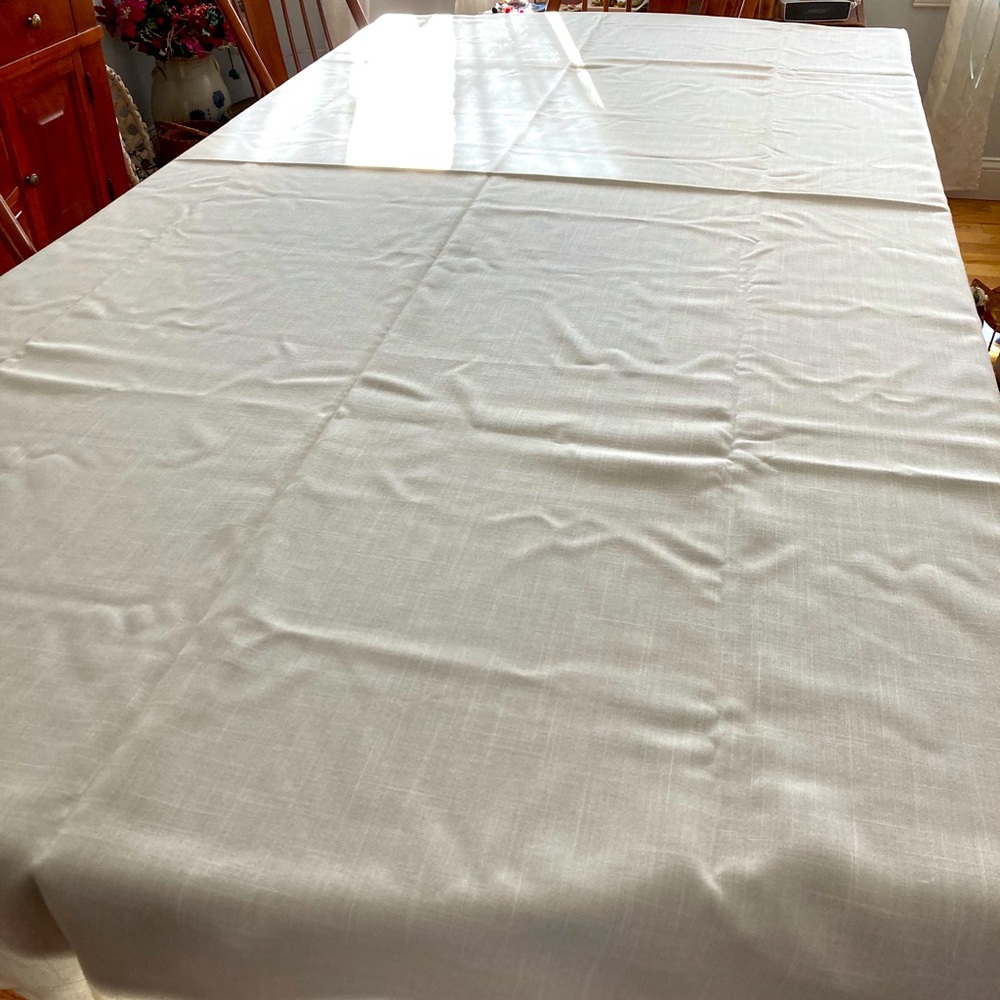Off white oval tablecloth 96” x 56”